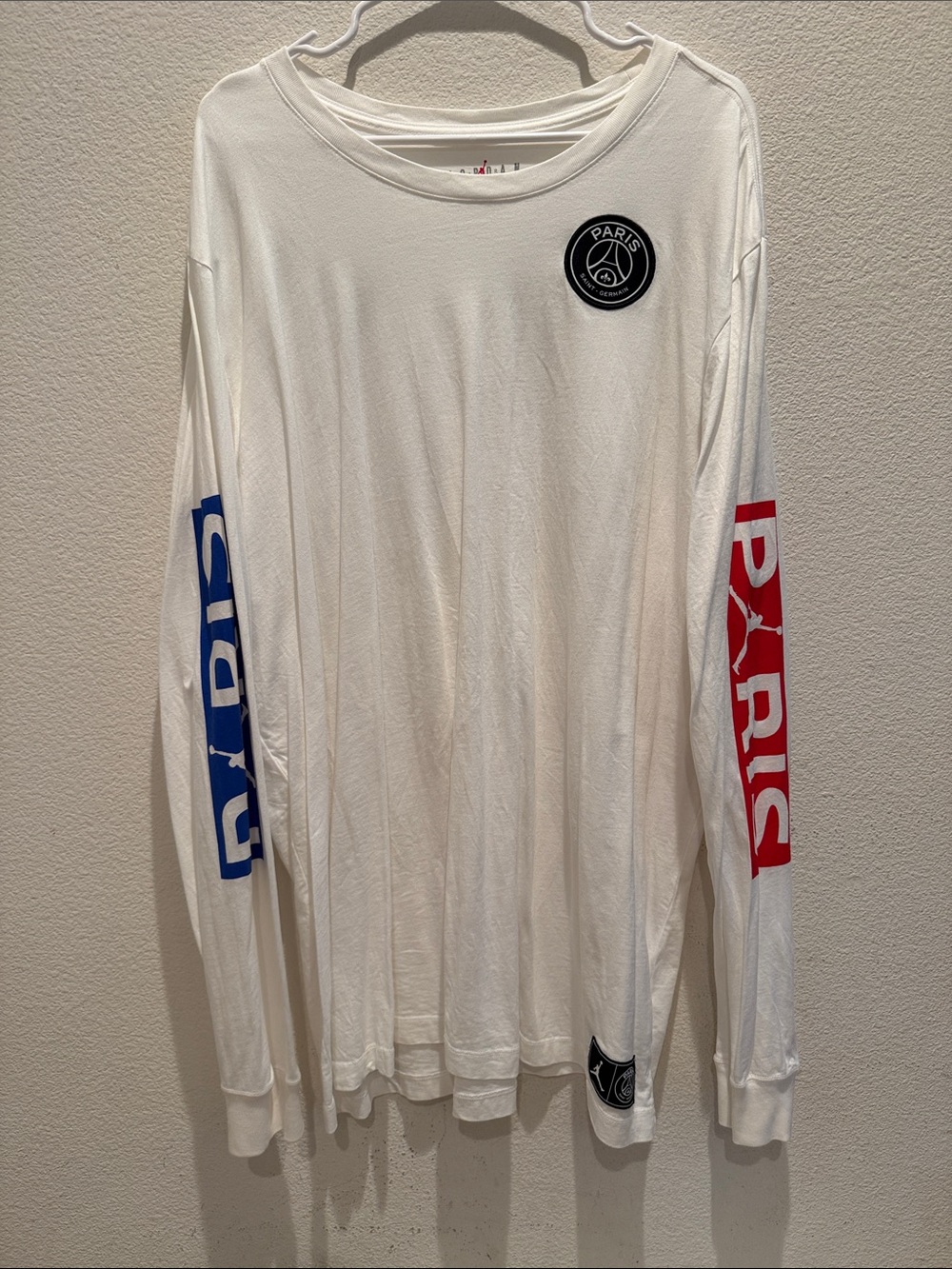 Jordan White Long Sleeve Tee with Blue and Red Sleeve Graphics